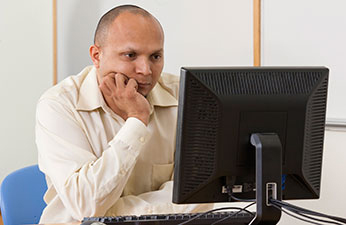 Man looking at a computer screen