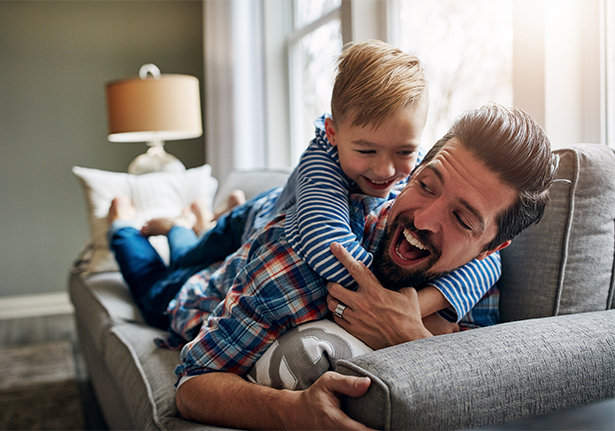 man and child playing