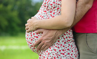 pregnant woman holding belly