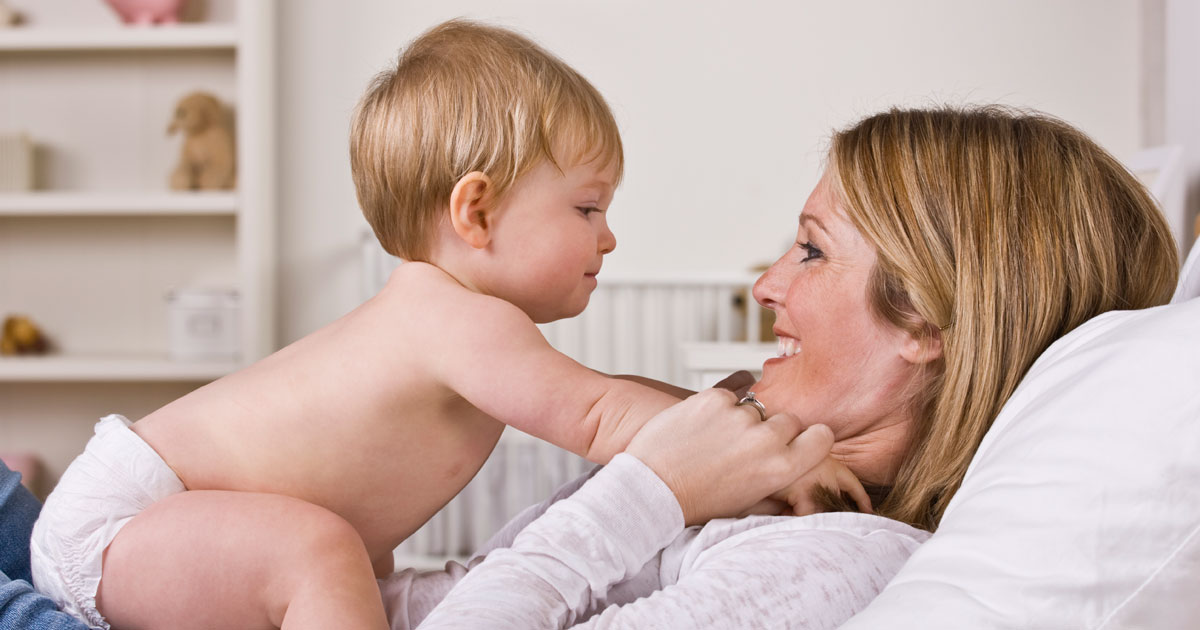 Smiling mother and happy baby