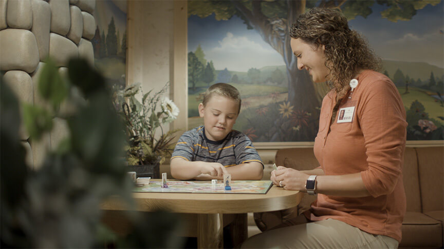 woman playing a game with a child