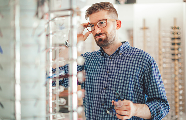 Man trying on glasses